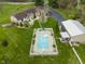 Backyard view of in-ground pool with lounge chairs, fence, and mature landscaping at 5455 S 800 E, Zionsville, IN 46077
