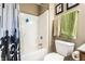 The bathroom features a shower-tub combo with a stylish curtain and neutral color scheme at 558 Prince Dr, Greenwood, IN 46142
