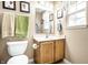 Well-lit bathroom with modern fixtures, vanity, and convenient toilet placement at 558 Prince Dr, Greenwood, IN 46142