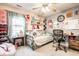 Cozy bedroom decorated with a unique style, featuring a comfortable bed, ample natural light, and personal touches at 558 Prince Dr, Greenwood, IN 46142