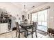 Charming dining area featuring a modern chandelier, access to the screened in porch and a stylish built in cabinet at 558 Prince Dr, Greenwood, IN 46142