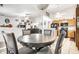 Open dining area with views into the living room and kitchen featuring hardwood floors and neutral paint at 558 Prince Dr, Greenwood, IN 46142