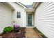 Welcoming front entrance with a decorative flower pot and manicured landscaping at 558 Prince Dr, Greenwood, IN 46142