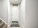 Inviting foyer with a white door, neutral paint, and tile flooring at 558 Prince Dr, Greenwood, IN 46142