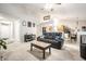 Open-concept living room with comfortable seating and views to the kitchen at 558 Prince Dr, Greenwood, IN 46142