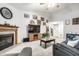 Spacious living room featuring a fireplace, television, and staircase at 558 Prince Dr, Greenwood, IN 46142