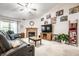 Bright living room featuring a fireplace, television, and comfortable seating at 558 Prince Dr, Greenwood, IN 46142