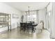 Elegant dining room with a modern chandelier, stylish decor, and a sliding glass door providing access to outdoor living at 561 Riviera Pl, Greenwood, IN 46143