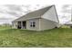 Brick home with a well-manicured lawn, featuring a covered patio at 561 Riviera Pl, Greenwood, IN 46143