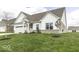 Charming single-Gathering home boasts a well-manicured lawn, stylish architectural details, and an attached two-car garage at 561 Riviera Pl, Greenwood, IN 46143