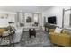 Spacious living room featuring a comfortable sectional sofa, modern decor, and plenty of natural light for a cozy atmosphere at 561 Riviera Pl, Greenwood, IN 46143