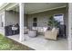 Covered patio featuring a comfortable seating area and outdoor grill at 561 Riviera Pl, Greenwood, IN 46143