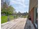 Wooden deck offering an outdoor seating area overlooking the grassy backyard and providing a tranquil retreat at 575 Crestpoint Ln, Plainfield, IN 46168