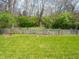 A well-maintained backyard, enclosed with a charming wooden fence, creating a private outdoor space at 575 Crestpoint Ln, Plainfield, IN 46168