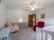 This bedroom has a rocking chair, comfortable reading chair and a crib at 575 Crestpoint Ln, Plainfield, IN 46168