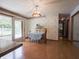 Cozy dining room featuring a table with a blue patterned tablecloth and access to the outdoor deck at 575 Crestpoint Ln, Plainfield, IN 46168