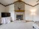Close-up of the brick fireplace, featuring a mantel, hearth, and decorative accents at 575 Crestpoint Ln, Plainfield, IN 46168