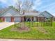 Charming single-story brick home with a well-manicured lawn and inviting curb appeal at 575 Crestpoint Ln, Plainfield, IN 46168