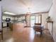 Bright kitchen and breakfast nook with white cabinets, wood flooring, and backyard access at 575 Crestpoint Ln, Plainfield, IN 46168
