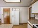 Kitchen with white refrigerator and cabinets at 575 Crestpoint Ln, Plainfield, IN 46168