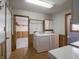 Well-lit laundry room with modern washer and dryer and ample storage space at 575 Crestpoint Ln, Plainfield, IN 46168
