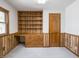 This office features built in shelving, lots of cabinets and a window at 575 Crestpoint Ln, Plainfield, IN 46168