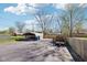 Paved backyard area with covered parking and a fenced perimeter for added privacy at 5831 Bar Del W Dr, Indianapolis, IN 46221