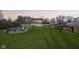 Spacious backyard with a fire pit area, surrounded by a wooden fence at 5831 Bar Del W Dr, Indianapolis, IN 46221