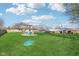 Spacious backyard with a fire pit and seating, perfect for outdoor gatherings and relaxation at 5831 Bar Del W Dr, Indianapolis, IN 46221