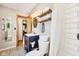 Bathroom features a sink, toilet, subway tiled shower, and open shelving at 5831 Bar Del W Dr, Indianapolis, IN 46221