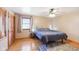 Bedroom features a ceiling fan, hardwood floor, and a double door closet at 5831 Bar Del W Dr, Indianapolis, IN 46221