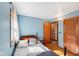 Charming bedroom featuring hardwood floors, natural light, and a door to another room at 5831 Bar Del W Dr, Indianapolis, IN 46221