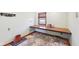 Bright bedroom featuring a built-in desk with natural light, hardwood floors, and light green walls at 5831 Bar Del W Dr, Indianapolis, IN 46221