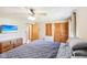 Bedroom with natural light, double door closet, hardwood floors, and doorway at 5831 Bar Del W Dr, Indianapolis, IN 46221