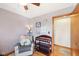 A Bedroom with a comfortable chair, changing table, and natural light, perfect for a baby's room at 5831 Bar Del W Dr, Indianapolis, IN 46221