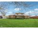 Charming two-story home featuring a covered front porch and a spacious green lawn at 5831 Bar Del W Dr, Indianapolis, IN 46221