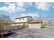 Home exterior with a two-car garage and fenced yard, offering both convenience and privacy at 5831 Bar Del W Dr, Indianapolis, IN 46221