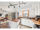 Open kitchen and dining area with stainless steel appliances and stylish finishes at 5831 Bar Del W Dr, Indianapolis, IN 46221