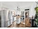 Spacious kitchen featuring stainless steel appliances, white cabinets, and a stylish backsplash at 5831 Bar Del W Dr, Indianapolis, IN 46221