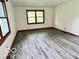 Bright bedroom featuring neutral paint and modern floors with lots of natural light at 5846 Bellsville Pike, Columbus, IN 47201