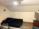 Bedroom with wood look floors and slanted ceilings at 5846 Bellsville Pike, Columbus, IN 47201