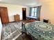 Spacious bedroom with wood floors, natural light, and a walk-in closet at 5846 Bellsville Pike, Columbus, IN 47201