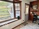 Welcoming entryway with natural light, shoe storage, and a view of the outdoors at 5846 Bellsville Pike, Columbus, IN 47201
