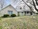 Quaint stone home with a covered porch, mature trees, and a picturesque setting at 5846 Bellsville Pike, Columbus, IN 47201
