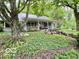 Charming home with a covered porch, stone accents, and a beautifully landscaped front yard at 5846 Bellsville Pike, Columbus, IN 47201
