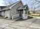 Charming home with a stone facade, accessible ramp, and well-maintained landscaping at 5846 Bellsville Pike, Columbus, IN 47201