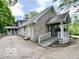Attractive stone-clad home with a covered entrance and ramp for easy accessibility at 5846 Bellsville Pike, Columbus, IN 47201