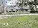 Charming stone and siding home with a welcoming front porch and well-maintained landscaping at 5846 Bellsville Pike, Columbus, IN 47201