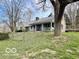 Charming single story home with a covered porch, perfect for enjoying the serene surroundings at 5846 Bellsville Pike, Columbus, IN 47201