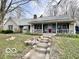 Attractive single-Gathering home featuring stone accents, a covered porch, and stone steps to front door at 5846 Bellsville Pike, Columbus, IN 47201